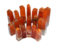 Several banded honey calcite crystal towers 85mm-140mm on white background