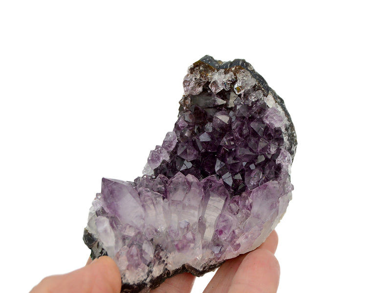 One purple amethyst druzy 95mm on hand with white background
