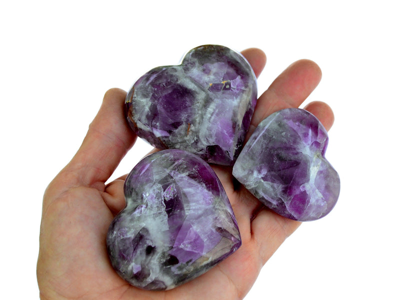 Chevron amethyst crystal hearts 50mm on hand with white background