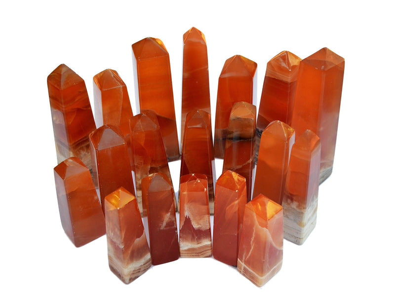 Several honey calcite crystal towers 85mm-140mm on white background
