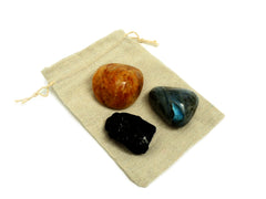 Raw black tourmaline, golden healer quartz tumbled and one labradorite tumbled crystal 50mm-60mm on small jute bag