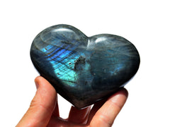 Extra large blue labradorite heart stone 90mm on hand with white background