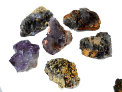 Some druzy purple fluorite specimens on white background