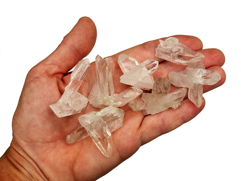 Some mini rock crystal clusters 30mm-40mm on hand with white background