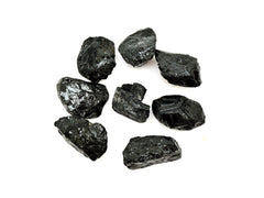 Eight rough black tourmaline crystals 20mm-55mmm on white background