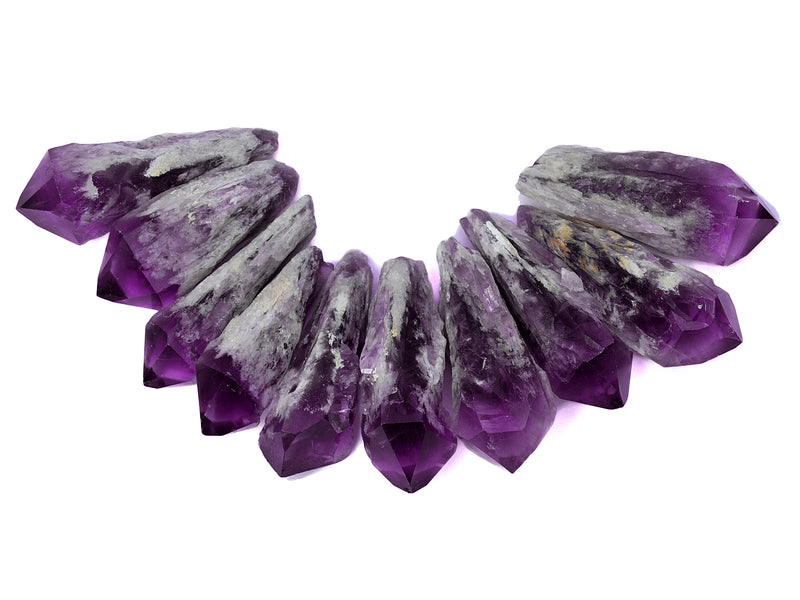 Some purple eslestial amethyst crystal points 60mm on white background