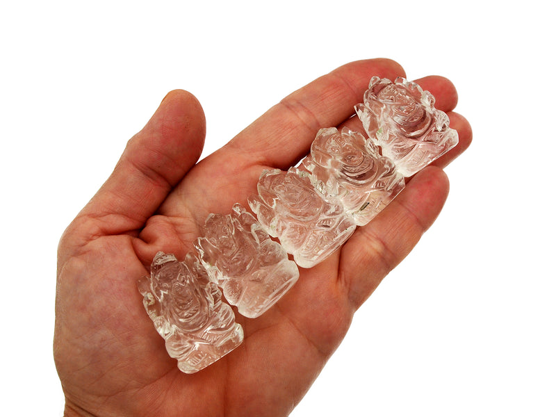 Five mini clear quartz ganesha figures 30mm on hand with white background