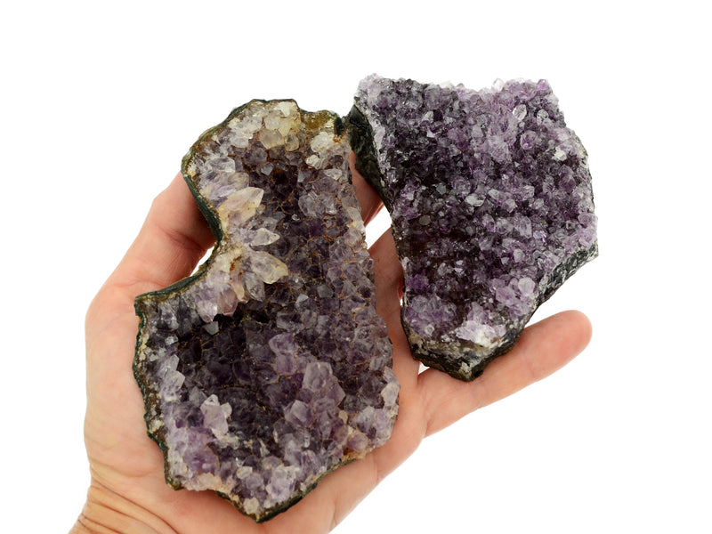 Two large purple druzy amethyst 100mm-110mm on hand with white background