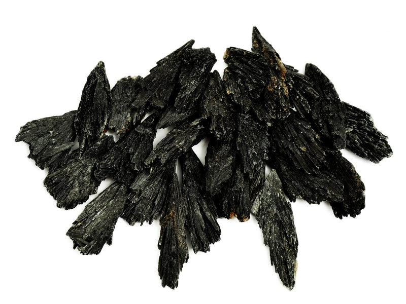 Several rough black kyanite crystals 40mm-90mm on white background