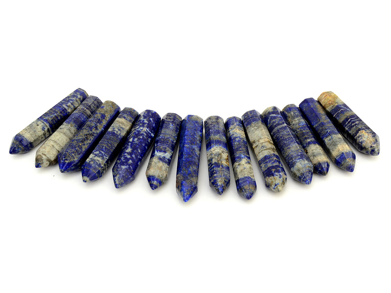 Some faceted lapis lazuli points 50mm-55mm on white background
