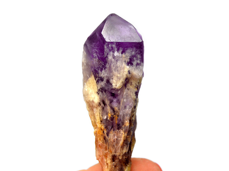 One raw elestial amethyst point 70mm on hand with white background