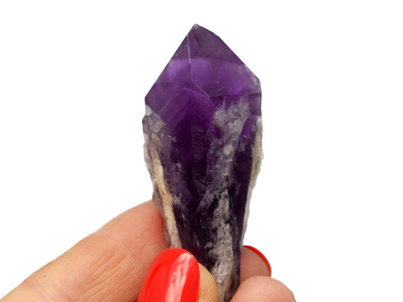 One raw elestial amethyst point 60mm on hand with white background