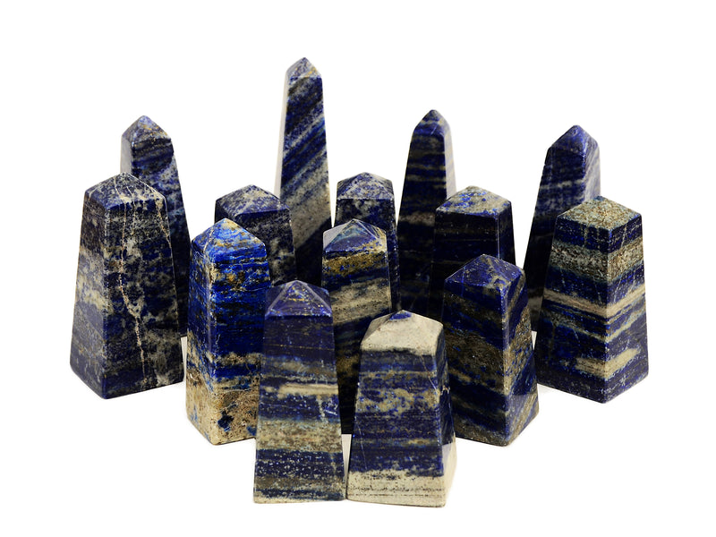 Some lapis lazuli obelisk stones 60mm-130mm on white background