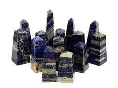 Some lapis lazuli obelisk stones 60mm-130mm on white background