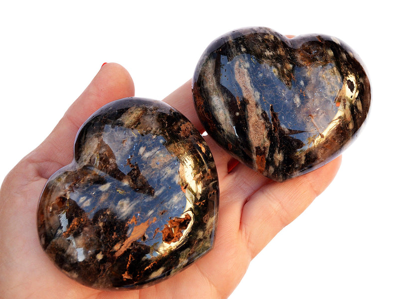Two big ocean jasper heart minerals 70mm on hand with white background