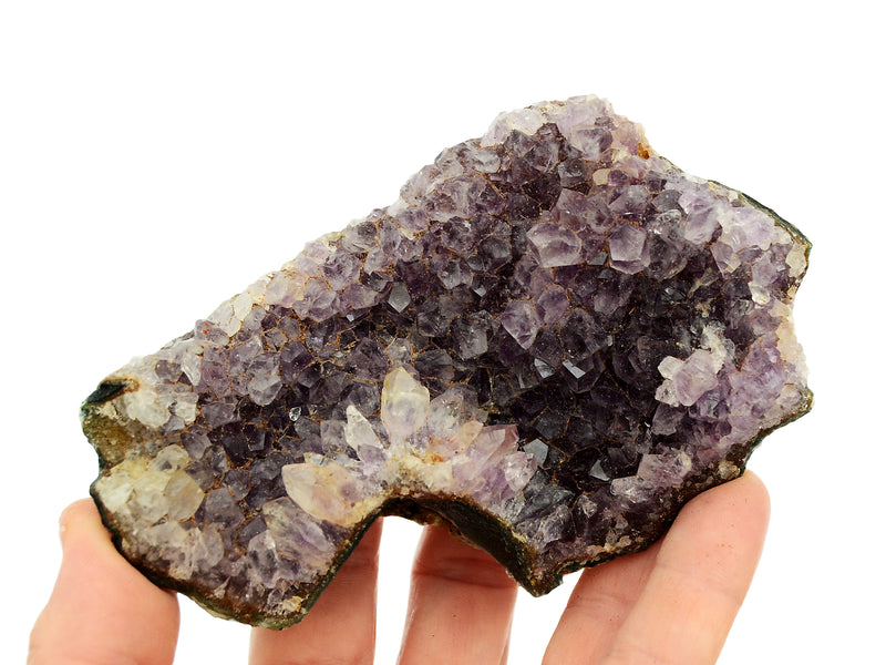 One large druzy amethyst 100mm on hand with white background