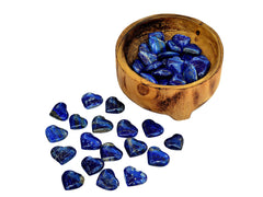 Somapis lazuli heart crystals 25mm-35mm inside a wood bowl with background with some crystals on white