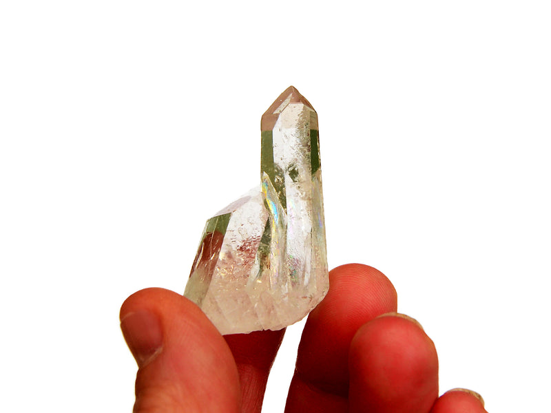 One mini clear quartz cluster 30mm on hand with white background