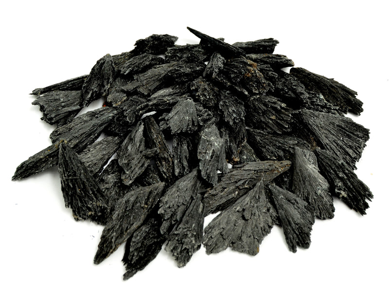 Several black kyanite raw crystals 30mm-100mm on white background