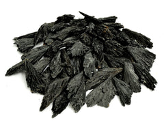 Several black kyanite raw crystals 30mm-100mm on white background