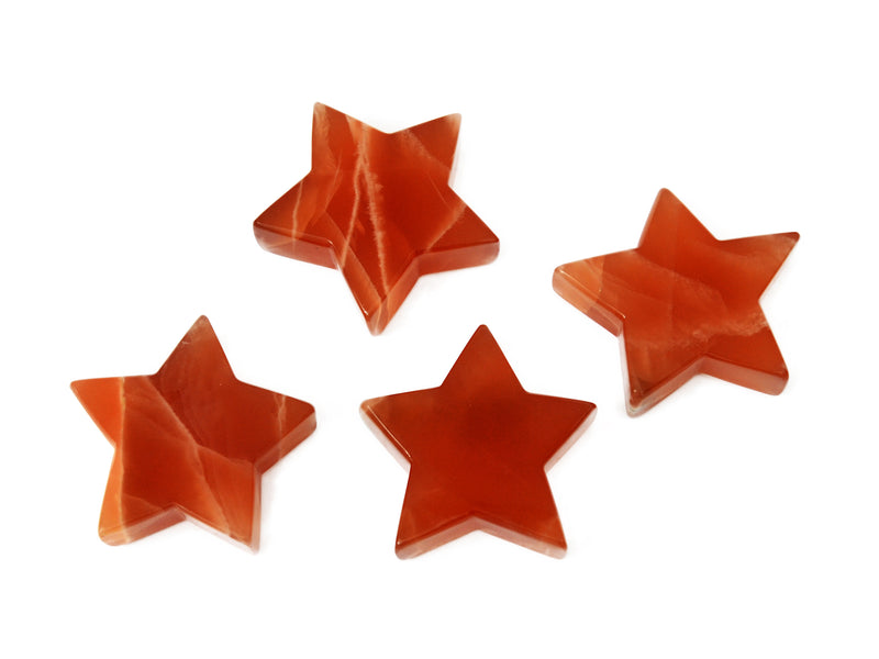 Four honey calcite stars 80mm-85mm on white background