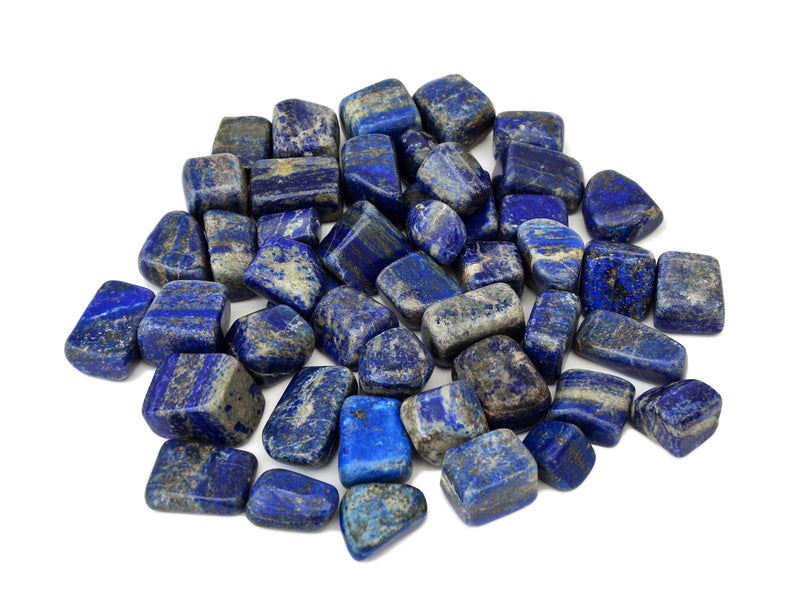 Several lapis lazuli mini tumbled stones on white background