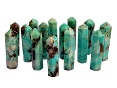 Several green amazonite crystal towers on white background