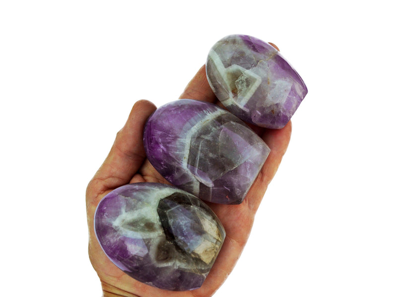 Three amethyst quartz free forms 55mm-75mm on hand with white background