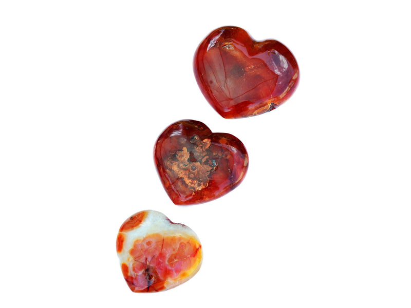 Three carnelian heart stones 65mm-100mm on white backround