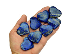 Eight lapis lazuli crystal hearts 35mm-40mm on hand with white background