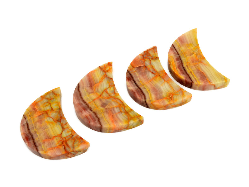 Four pink banded onyx stones 80mm-85mm on white background