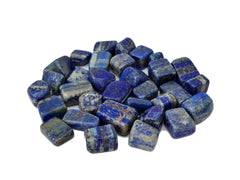 Several lapis lazuli tumbled minerals on white background