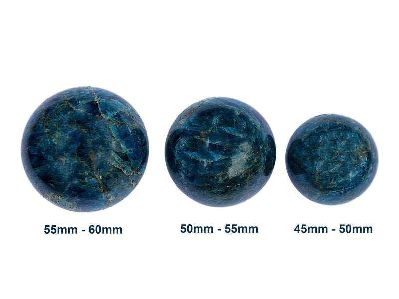 Three blue apatite crystal spheres 45mm-60mm on white background