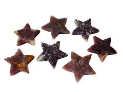 Some lepidolite star crystals 95mm-100mm on white background