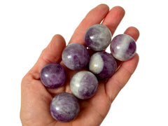 Some amethyst sphere 25mm-35mm on hand with white background