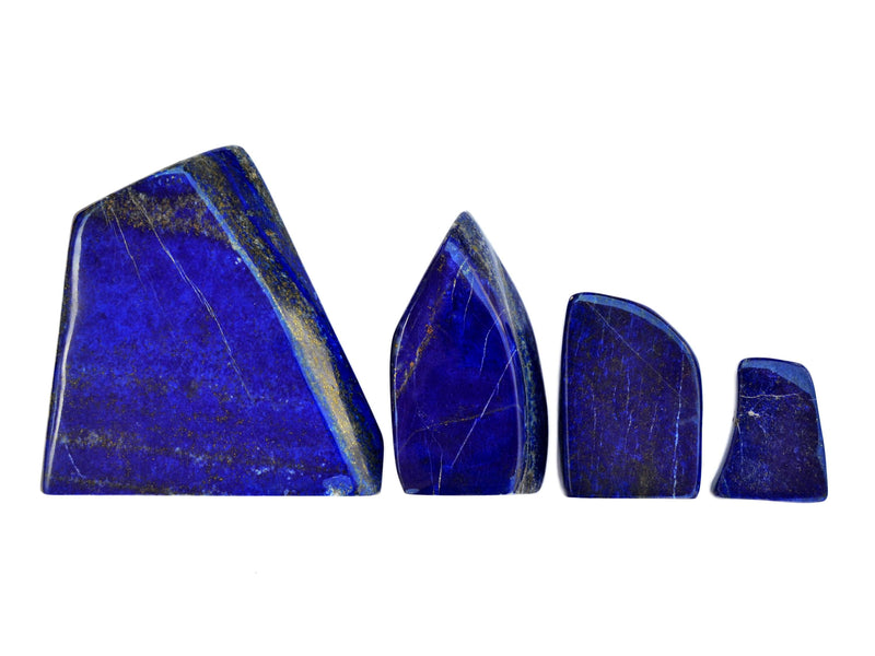 Four lapis lazuli slabs different sizes 40mm-150mm on white background