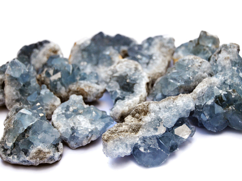 Several celestite rough crystals on white background