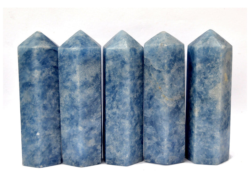 Five blue calcite crystal towers 110mm on white background