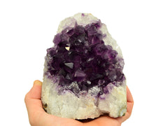One druzy amethyst cut base 115mm on hand with white background