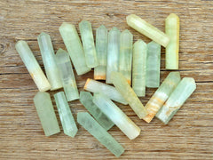 Several green blue caribbean calcite towers 55mm-60mm on wood table