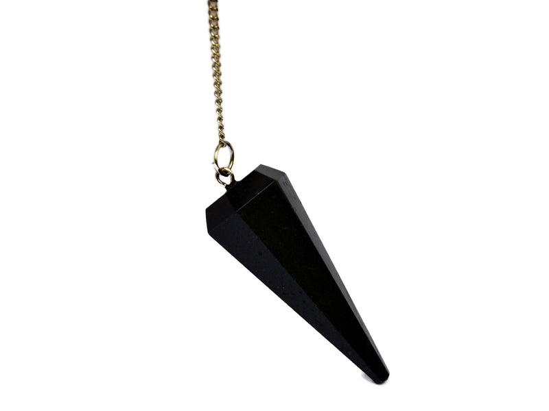 One black tourmaline crystal pendulum with silver chain on white background