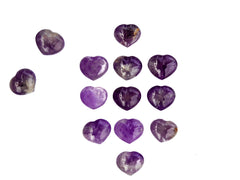 Several amethyst crystal hearts 30mm on white background