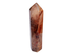 One large fire quartz tower 240mm on hand on white background 