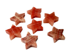 Seven rose calcite star crystals 78mm-80mm on white background