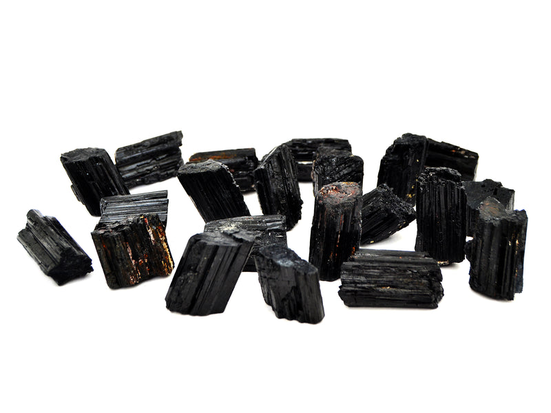 Several raw black tourmaline stones 35mm-45mm on white background