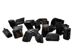 Several raw black tourmaline stones 35mm-45mm on white background