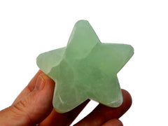 One green pistachio calcite stard carvving crystal 60mm on white with white background