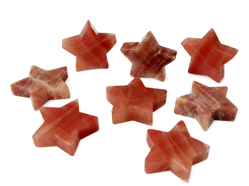 Some rose calcite star crystals 78mm-80mm on white background