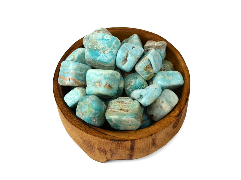 Several blue aragonite mini tumbled stones inside a wood bowl