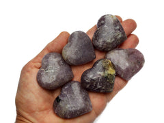 Six lepidolite crystal hearts 35mm-40mm on hand with white background
